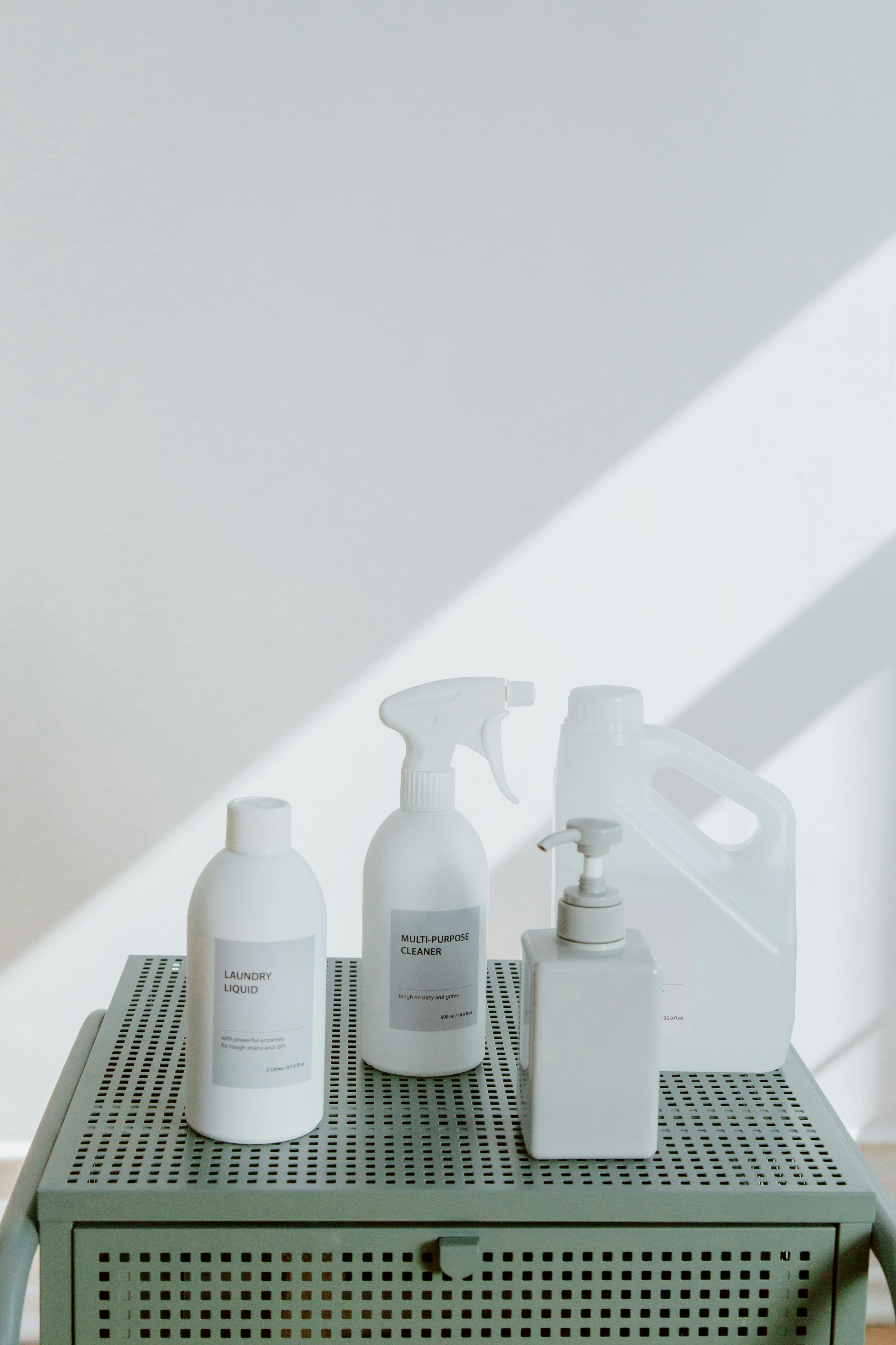 Cleaning product bottles arranged on shelf